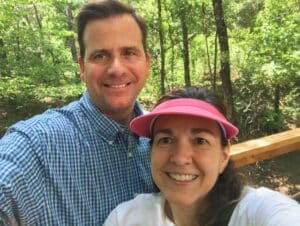 a man and a woman in the woods