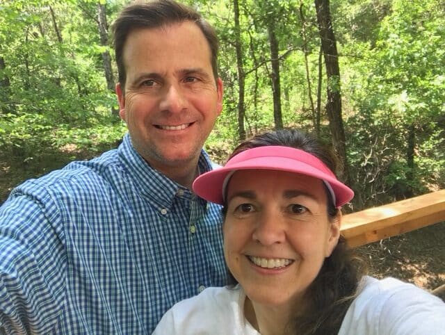 a man and a woman in the woods